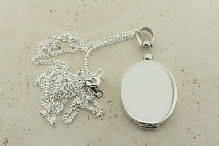 oval locket pendant on 55cm link chain